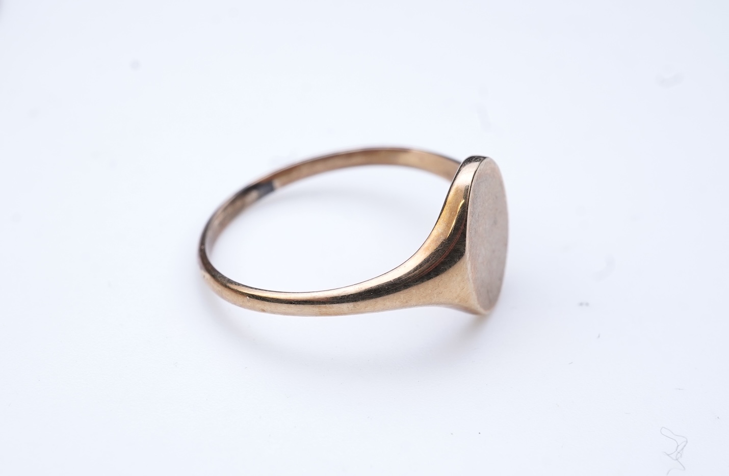 Four brooches and a gold signet ring